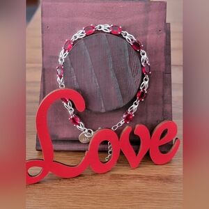 Radiant Ruby Red and Sterling Silver Bracelet. Stamped S925, NWOT.